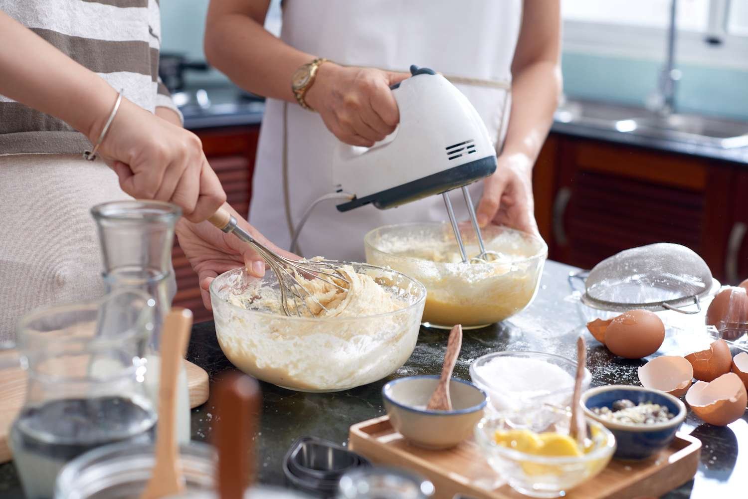 a person using a mixer to mix ingredients