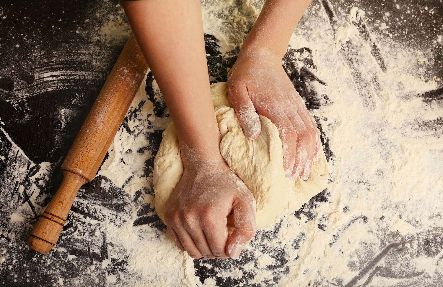 The Best Bakery Equipment for Bread / Bake Batter & Beyond a person kneading dough on a table