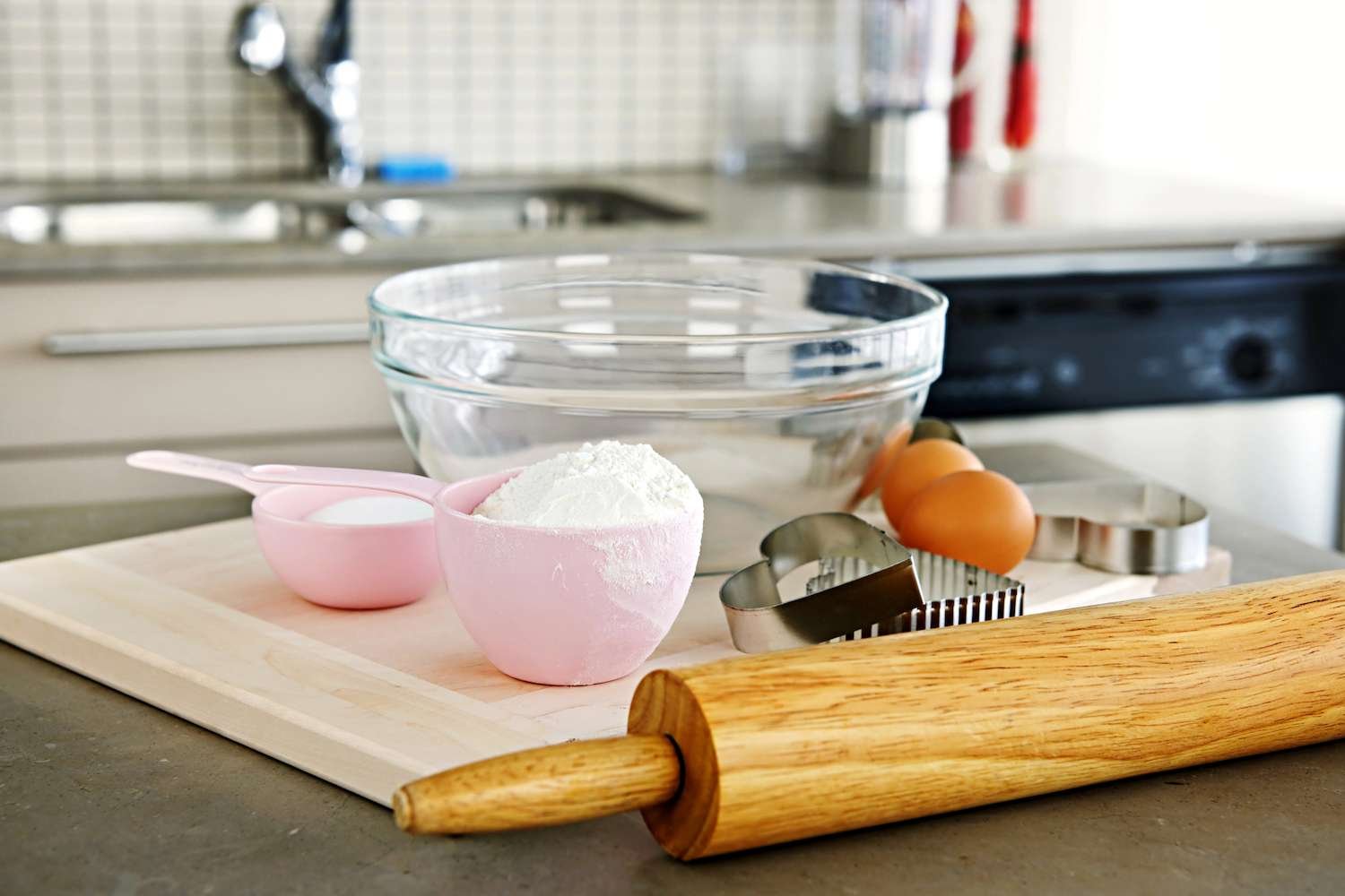 a rolling pin and a bowl of flour