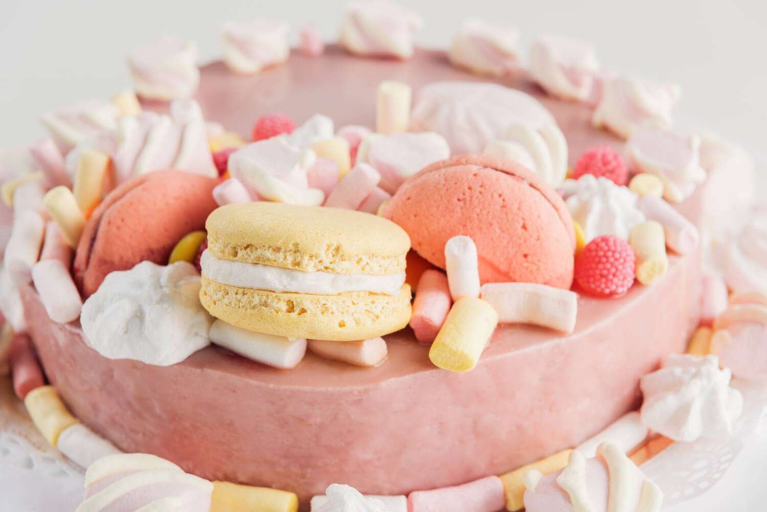 a cake with macarons on top