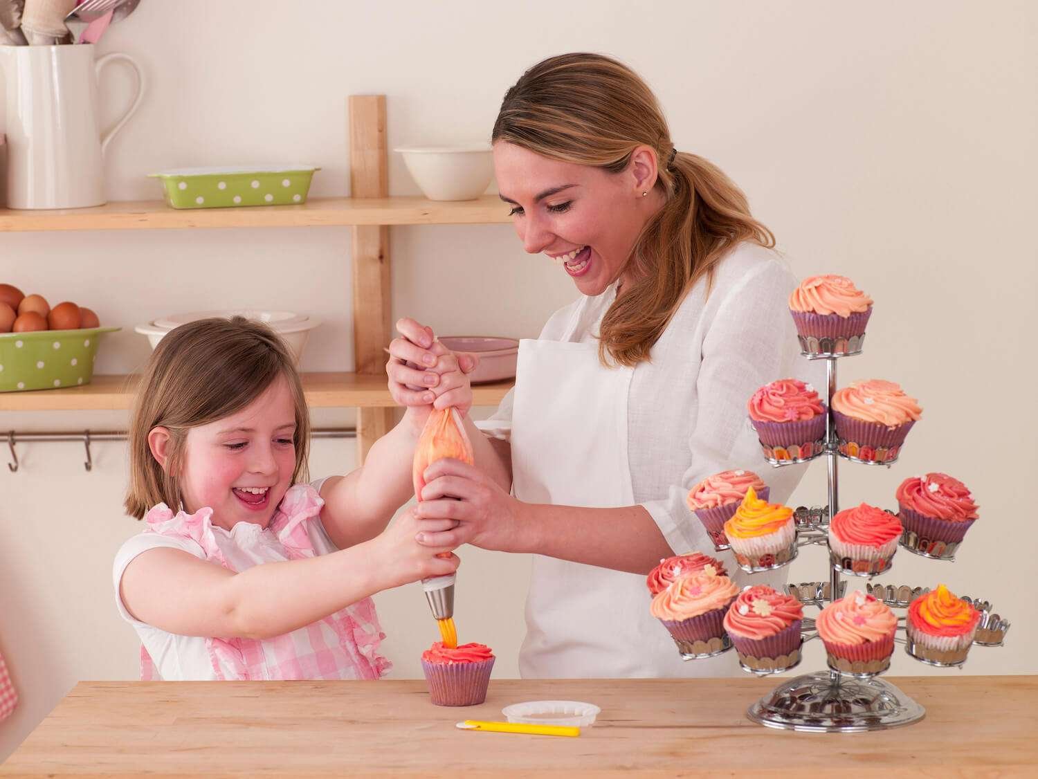 Simple Cake Decorating Ideas / Bake Batter & Beyond a woman and a girl decorating cupcakes