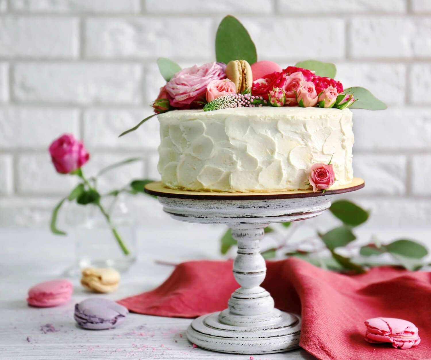 Cake Decorating Tips: How to Prevent Air Bubbles in Buttercream Icing / Bake Batter & Beyond a cake with flowers on top