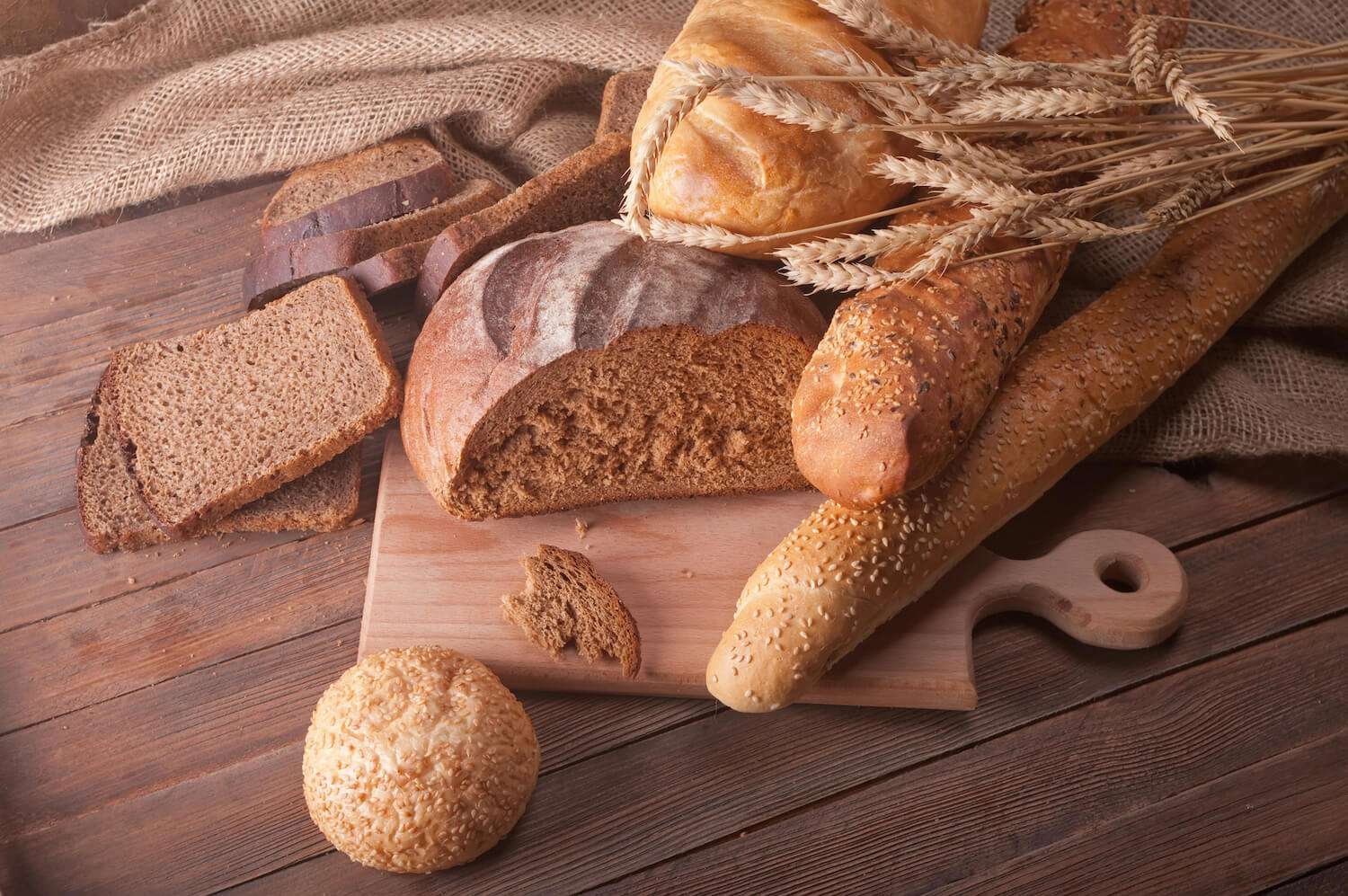 a group of bread on a cutting board