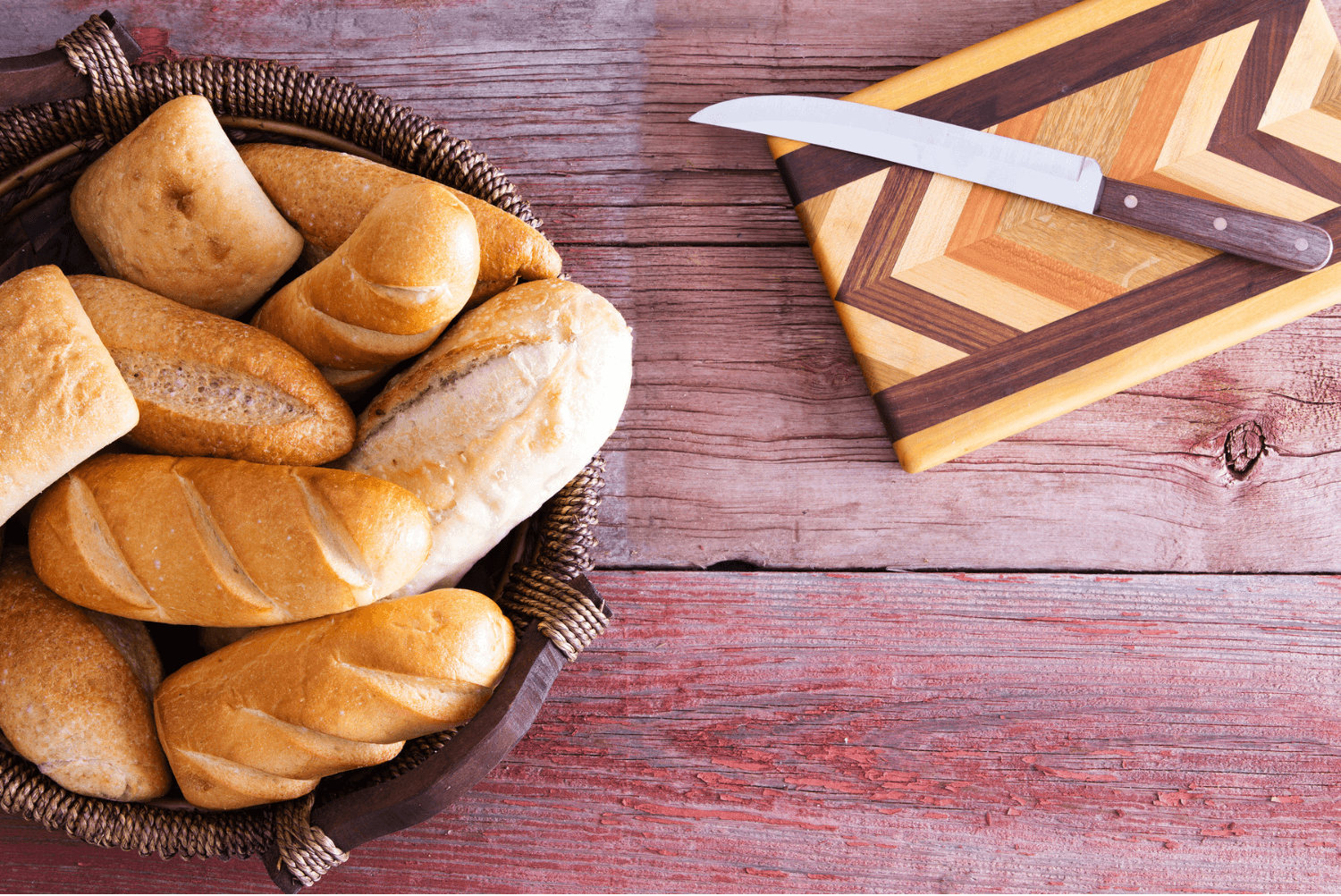 a basket of bread and a knife