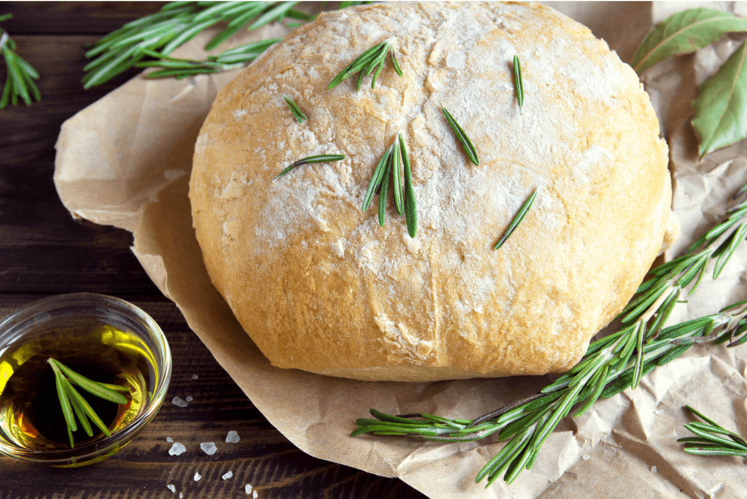 a loaf of italian bread with rosemary sprinkled on top
