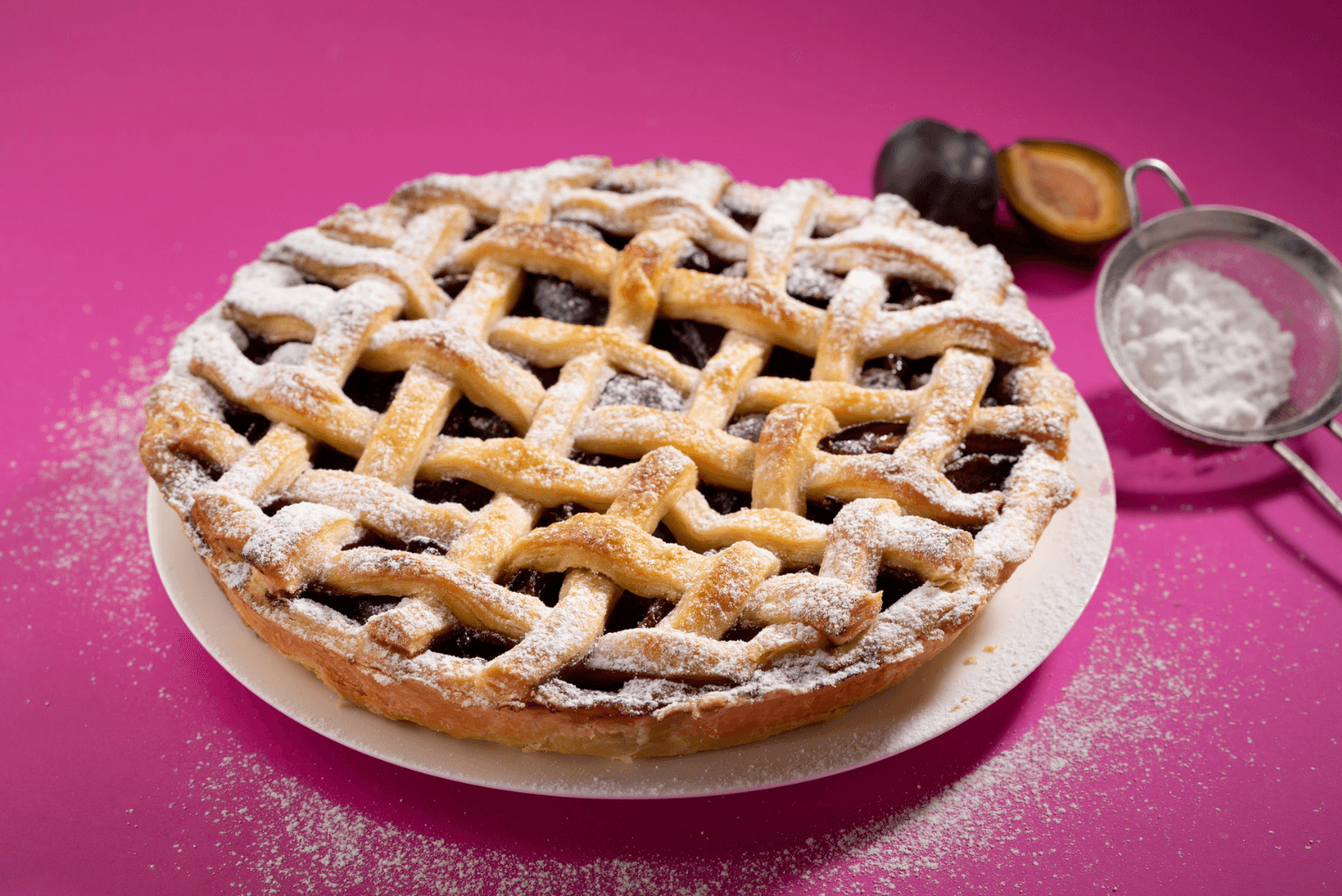 a pie with a lattice top and a spoon