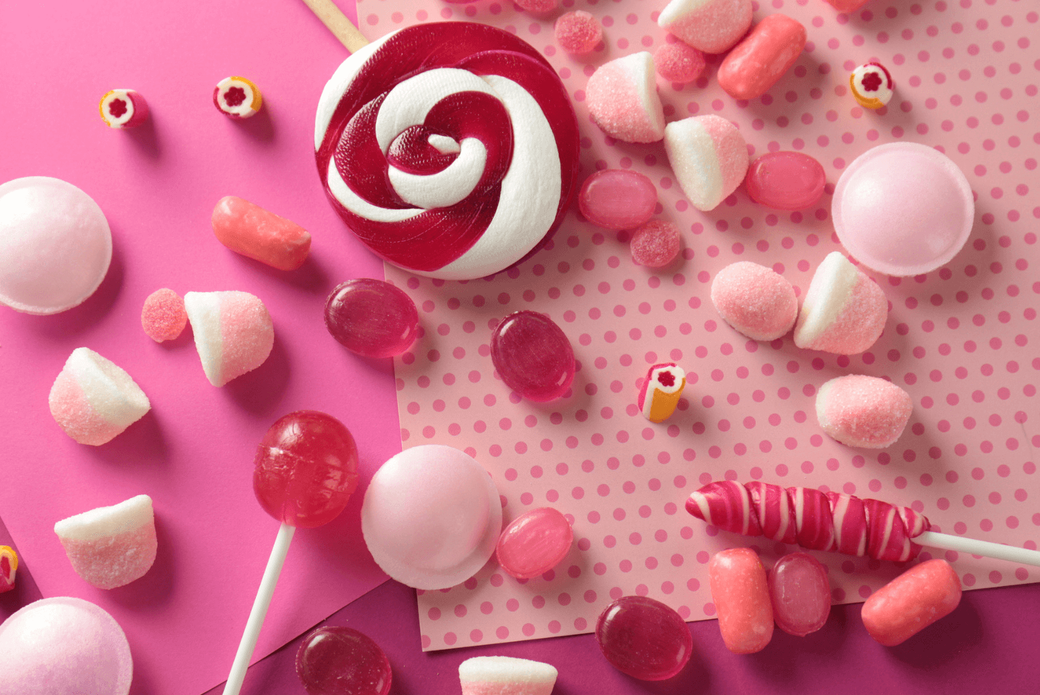 a group of different colored candies