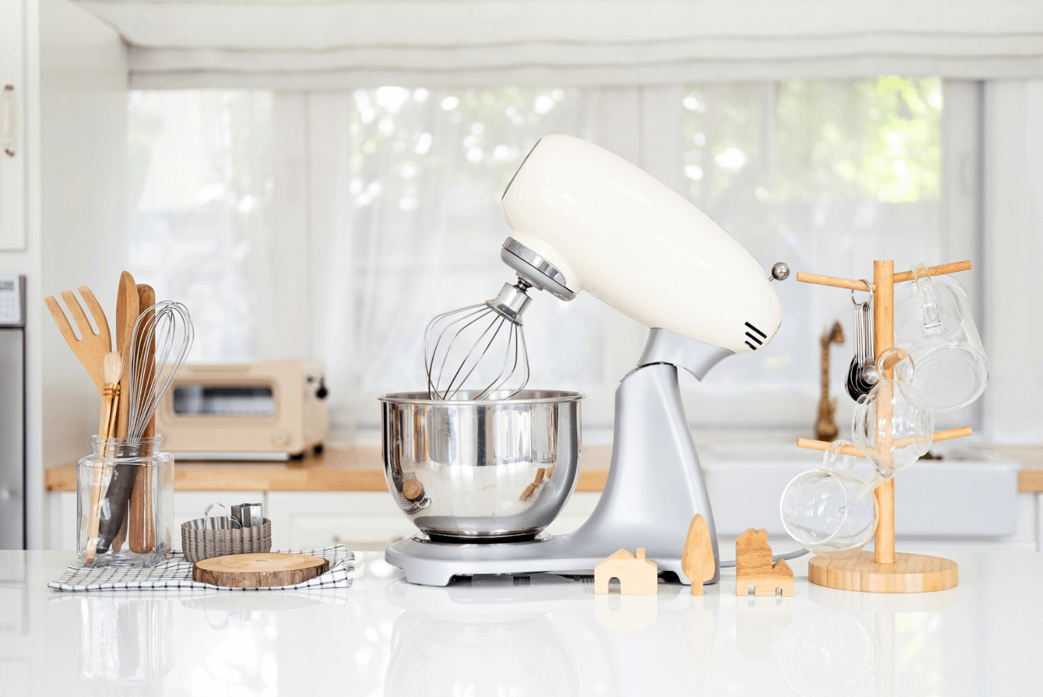 a stand mixer and other kitchen utensils on a counter