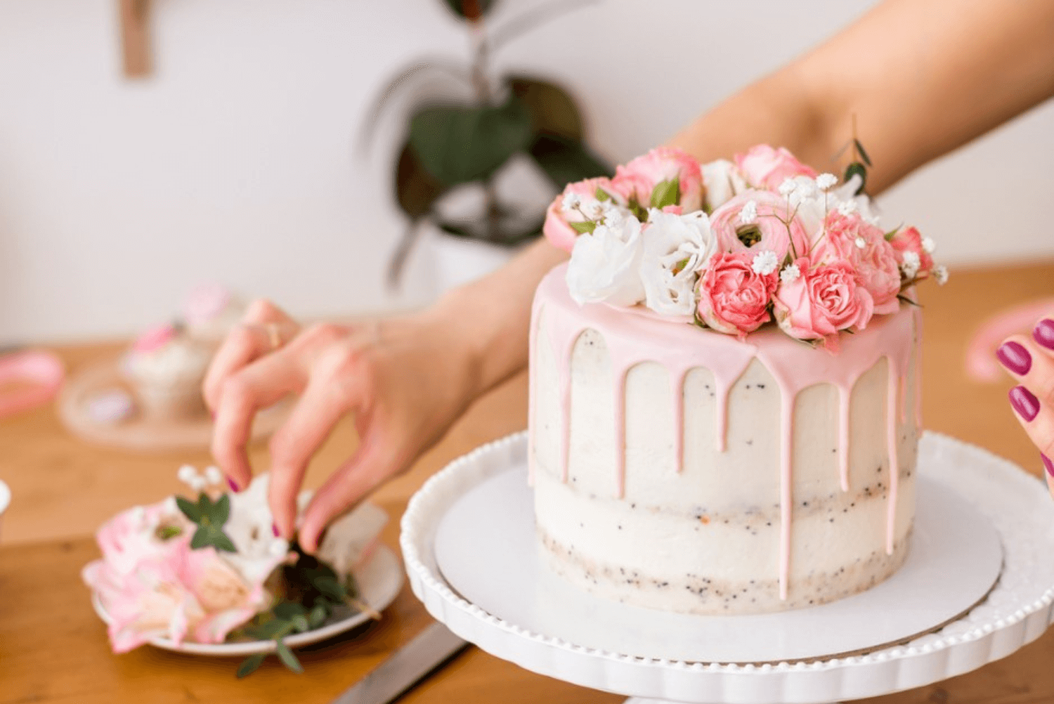 a person decorating a cake